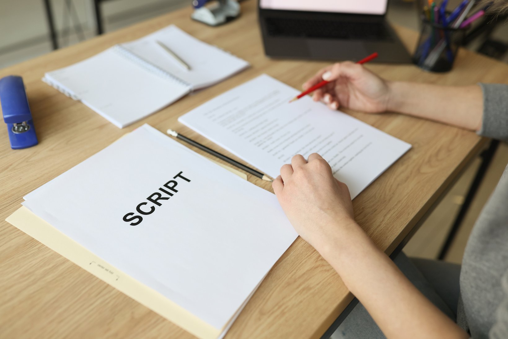 Actress Checks Script Papers Making Notes with Pencil