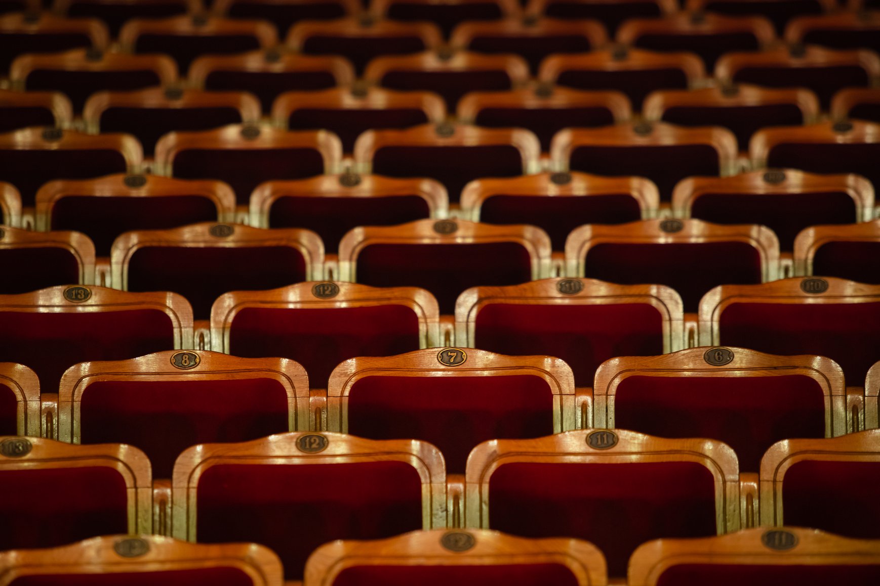 Row of red seats in theatre